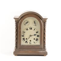 Lot 103 - German oak cased mantel clock, arched silvered dial, ...