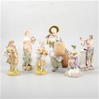 Lot 39 - Pair of French bisque figurines of a young couple, and seven other Continental figures (9).