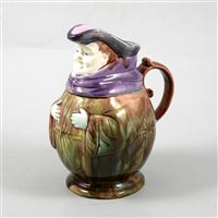 Lot 7 - French Majolica style jug, modelled as a rotund toby, 22cm.