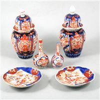Lot 80 - Pair of Imari covered vases, two small Imari bottle vases, three bowls, plates and dishes.