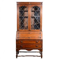 Lot 420 - An oak bureau bookcase