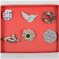 Lot 197 - A "Taylor Maid" vintage paste set brooch and matching earclips in original box, five paste set brooches - flower, butterfly, circular flower head design etc