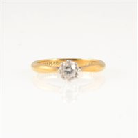Lot 247 - A diamond solitaire ring, the brilliant cut stone illusion set in a yellow and white metal mount marked 18ct & Plat, approximate size of stone 0.12 carat, ring size J.