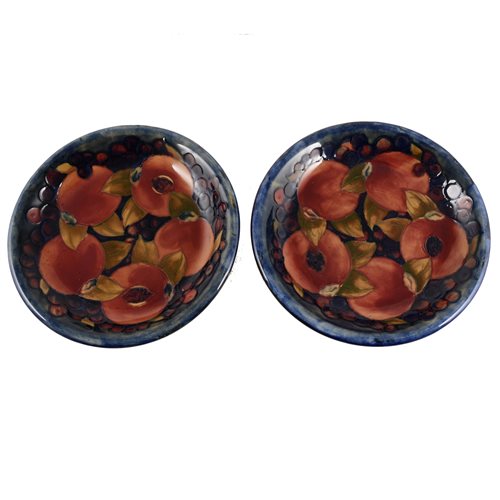 Lot 28 - A pair of William Moorcroft plates, 'Pomegranate' design, circa 1920