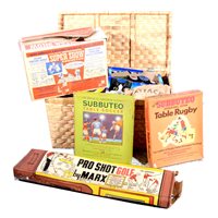 Lot 305 - Wicker toy box of vintage games and toys; including Subbuteo football and others.