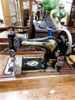 Lot 435 - Singer hand sewing machine, in a walnut case, width 43cm; and a Jones sewing machine, (2).