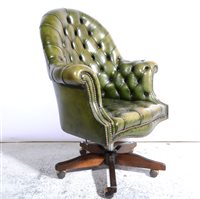 Lot 450 - Modern buttoned green leather swivel desk chair, width 80cm.