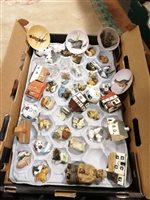 Lot 45 - Two boxes of porcelain and ceramic figures, including Wade Whimsies, Mudlen End cottages, Beswick and others.