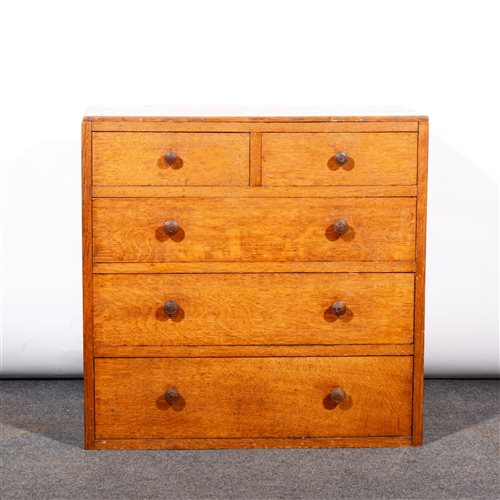 Lot 505 - An English Arts & Crafts style oak chest of drawers