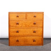 Lot 505 - An English Arts & Crafts style oak chest of drawers