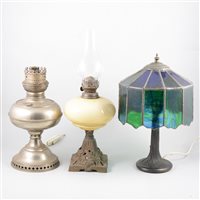Lot 146 - Various lamp bases, oil lamps, and additional glass shades and chimneys.