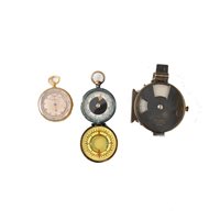 Lot 192 - Brass pocket barometer, a Woods military gun sight, and a pocket compass.