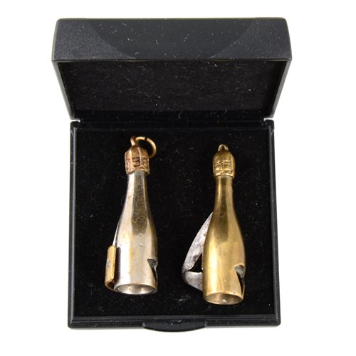 Lot 186 - Two novelty cigarette cutters in the form of champagne bottles