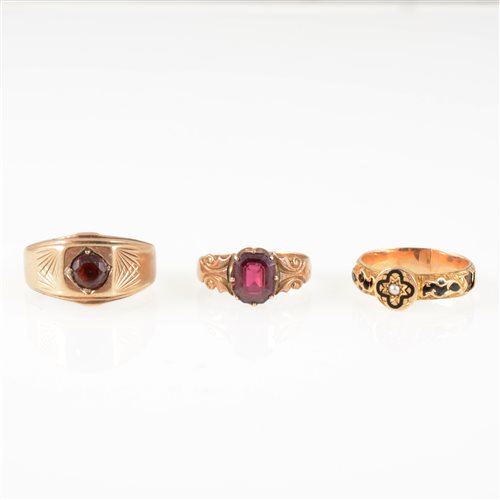 Lot 240 - Three vintage gold rings, a gentleman's 9 carat yellow gold signet ring set with a round brilliant cut garnet, gross weight approximately 6.1gms
