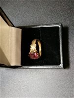 Lot 240 - Three vintage gold rings, a gentleman's 9 carat yellow gold signet ring set with a round brilliant cut garnet, gross weight approximately 6.1gms