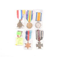 Lot 197 - Assorted 20th century military medals and cap badges.