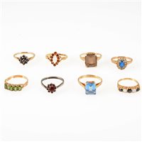 Lot 239 - Eight gemset dress rings, garnet, sapphire, opal, smoky quartz, synthetic blue and white stones, CZ, one silver set, the rest hallmarked 9 carat gold or marked 9ct. ring sizes M-P. (8)