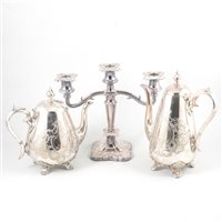 Lot 142 - A four-piece silver plated tea set, three-light candlestick, other plated ware and silver napkin rings.