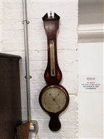 Lot 106 - A Regency inlaid mahogany banjo shaped wall barometer