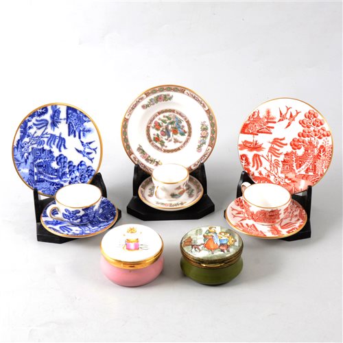 Lot 28 - A collection of modern enamel pill boxes and miniature  Wedgwood trios.