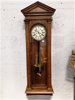 Lot 204 - A Vienna type wall clock, later oak "regulator" case