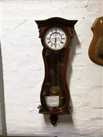 Lot 211 - Continental simulated rosewood cased wall clock