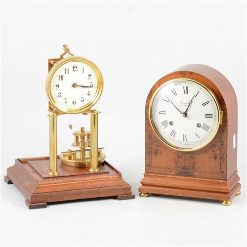 Lot 170 - A 400 day anniversary clock, and a reproduction mantel clock by Comitti of London, yew wood case.