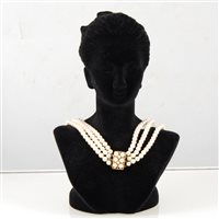 Lot 255 - A cultured pearl choker, one hundred and ninety-two 5.2mm cultured pearls strung into a three row choker with a yellow metal fastener
