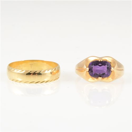 Lot 243 - Two gold rings, an oval mixed cut amethyst four claw set into a yellow metal dress ring mount, shank marked 585, gross weight approximately 3.1gms, ring size S