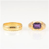 Lot 243 - Two gold rings, an oval mixed cut amethyst four claw set into a yellow metal dress ring mount, shank marked 585, gross weight approximately 3.1gms, ring size S
