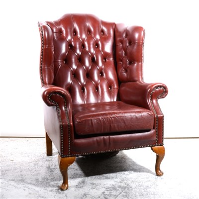 Lot 413 - Leather wing-back armchair.