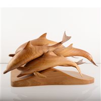 Lot 652 - Brian and Rachel Hancock, 'Ocean Leap - Pod of Common Dolpin', a carved elm sculptural group,.