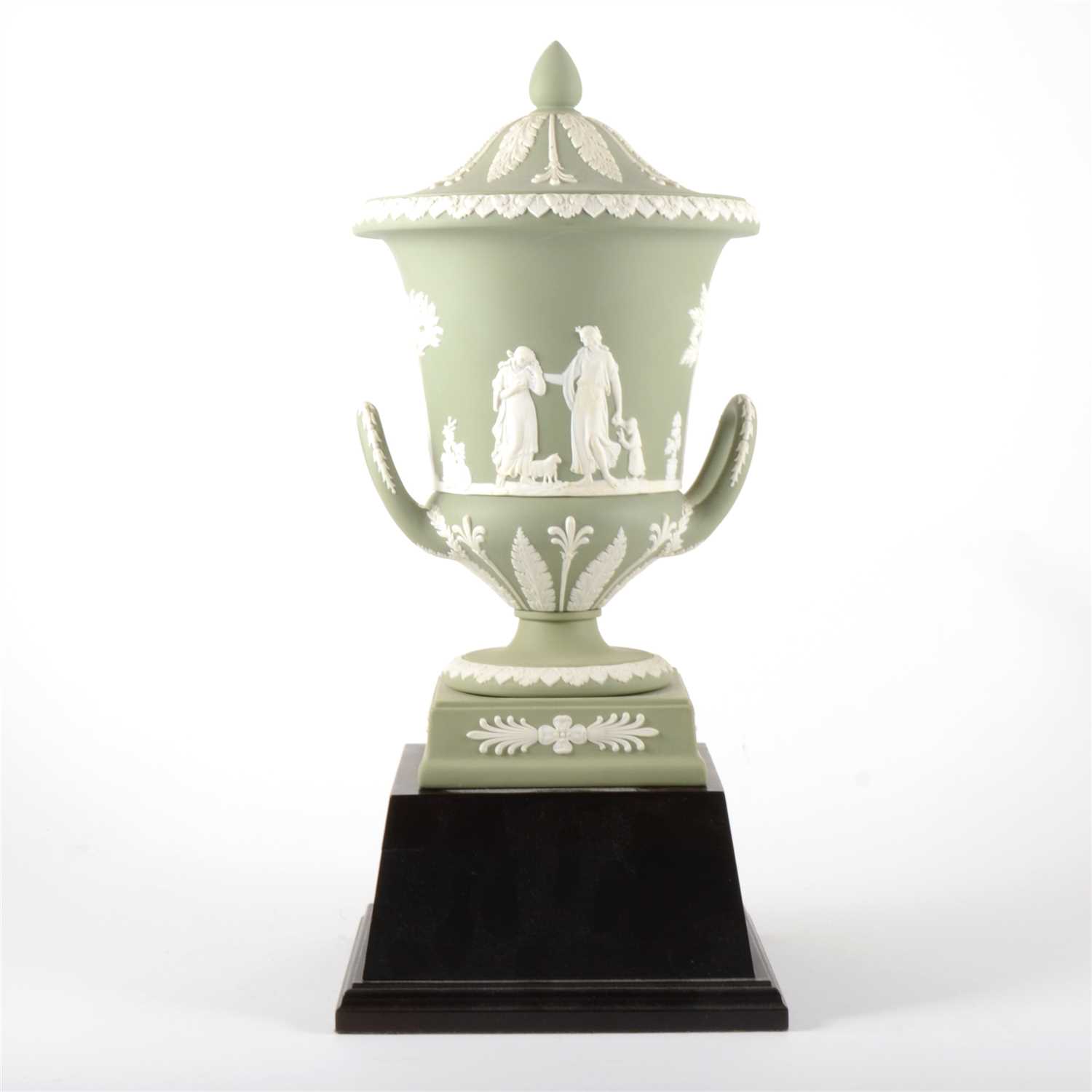 Lot 27 - A green Jasperware campagna vase and cover, by Wedgwood.