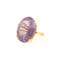Lot 241 - A large amethyst dress ring, the oval step cut stone 22mm x 15mm x 9.5mm, approximate carat weight 15.5cts