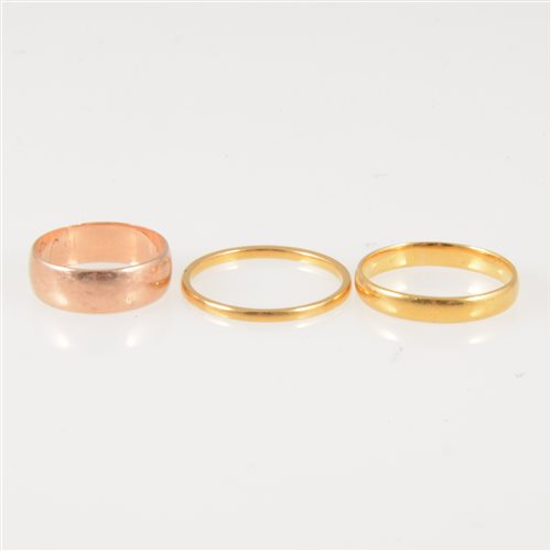 Lot 245 - Three plain gold wedding rings, two 22 carat yellow gold wedding rings, 1.4mm wide, approximate weight 1.9gms, ring size Q, 3.2mm wide, 2.5gms