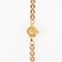 Lot 294 - Doxa - a lady's gold bracelet watch, circular dark champagne baton dial in an 18 carat yellow gold 14mm case hallmarked London (imported) 1956