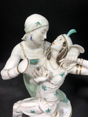 Lot 597 - A hard-paste porcelain figural lamp base by Gustav Oppel, depicting Nijinski and the Ballet Russes