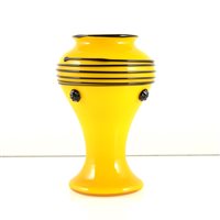 Lot 586 - A yellow glass vase with black prunts and trailing, in the manner of Michael Powolny for Loetz