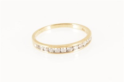 Lot 258 - A diamond half eternity ring, twelve brilliant cut diamonds graduating in size, channel set in a 9 carat yellow gold mount