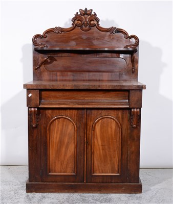 Lot 399 - Victorian mahogany chiffonier, scrolling cresting over a serpentine shelf, base with frieze drawer over two panelled doors, plinth base, width 92cm, height 152cm.