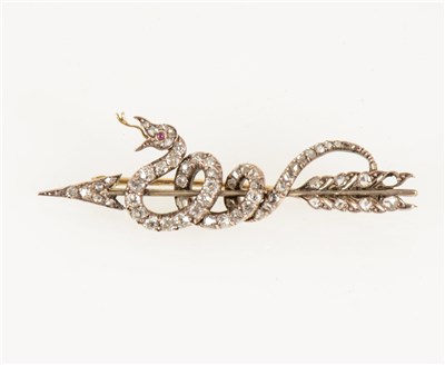 Lot 183 - An arrow and coiled snake design brooch set with rose cut diamonds (one missing), 50mm long.