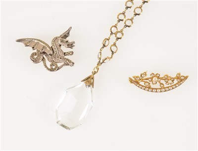 Lot 194 - A crystal sautoir of round brilliant cut paste with clear crystal pendant drop, length 80cm, a yellow metal open crescent brooch with floral spray all set with seed pearls, 40mm