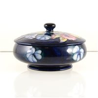 Lot 561 - A Moorcroft Pottery box and cover, 'Orchid' design