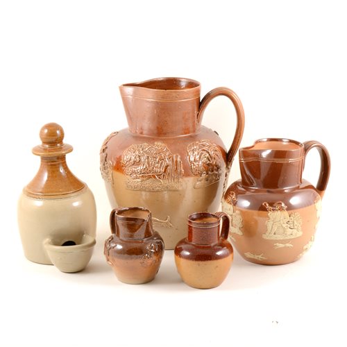 Lot 31 - Doulton and other stoneware pottery, a Fulham Pottery 22cm salt glazed harvest jug, three Doulton harvest jugs 16cm,14.5cm and 9cm