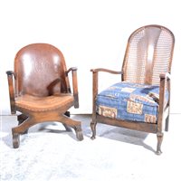 Lot 432 - Stained wood and leather upholstered tub chair, (damaged)