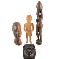 Lot 92 - A tray of African carved wooden artefacts, a full sized mask, drummer boy, coloured fruit, pair of salad servers, hardwood bust, female fertility figure, small pod water carrier, etc