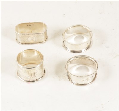 Lot 173 - Four Edwardian and later silver napkin rings.