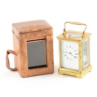 Lot 116 - French brass cased carriage clock, rectangular enamelled dial with Roman numerals, repeatingmovement striking on a gong, 14cm, with leather bound travelling case.