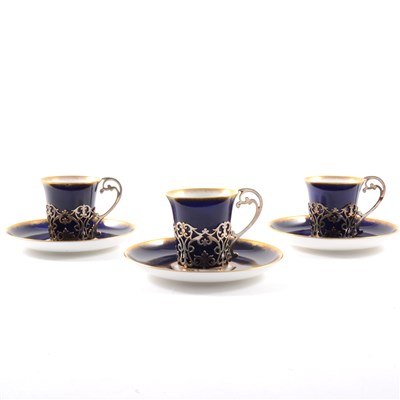 Lot 39 - A set of six Aynsley bone china coffee cans and saucers, the cans with silver frames