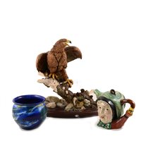 Lot 15 - A David Fryer sculpture "Robin in a Boot", resin model of an eagle, two character teapot, blue ceramic pot.